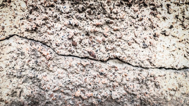 Old stone wall with a crack. texture for design