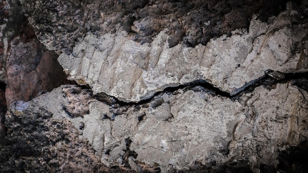 Old stone wall with a crack. texture for design