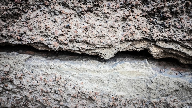 Old stone wall with a crack. texture for design