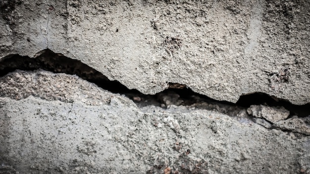 Old stone wall with a crack. texture for design