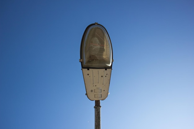 Old street lamp Damaged street lighting Lamppost during the day