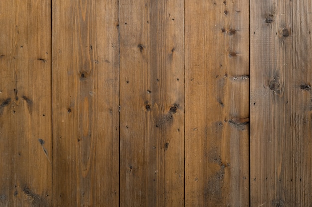 Foto vecchia struttura a strisce del fondo della parete di legno.