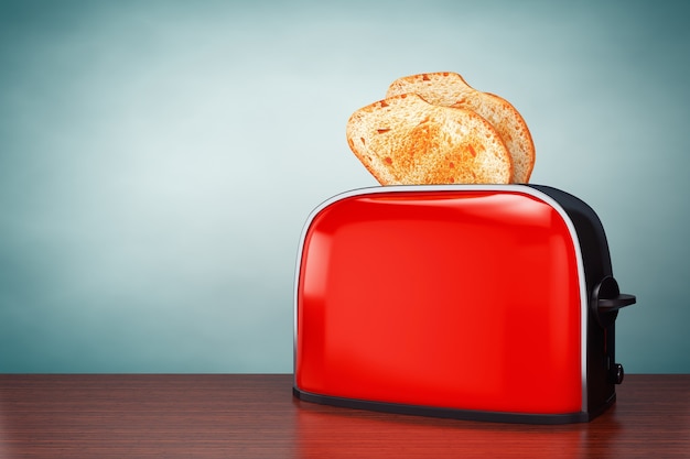 Old Style Photo. Toast popping out of Vintage Red Toaster on the table