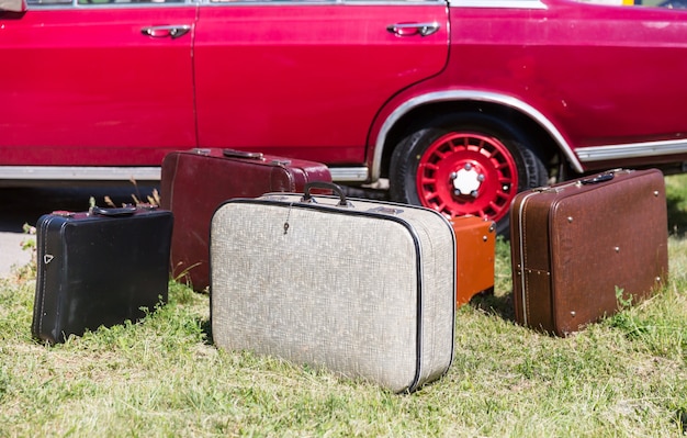 Photo old suitcases near the car