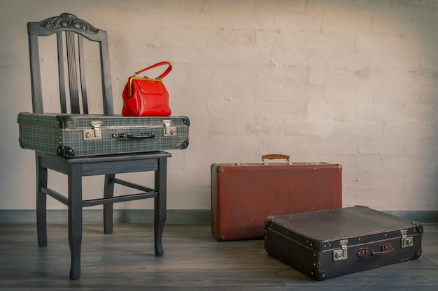 Old suitcases and red bag