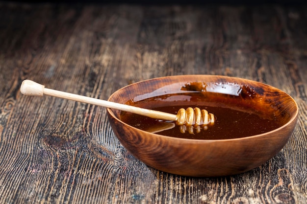 Old table on which there is a healthy and sweet bee honey