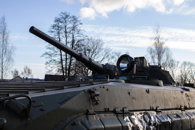 Old tank on the blue sky background