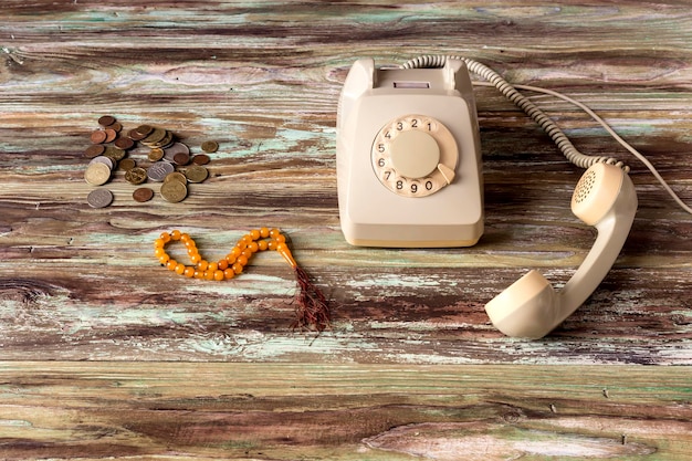 An old telephone on a wooden table