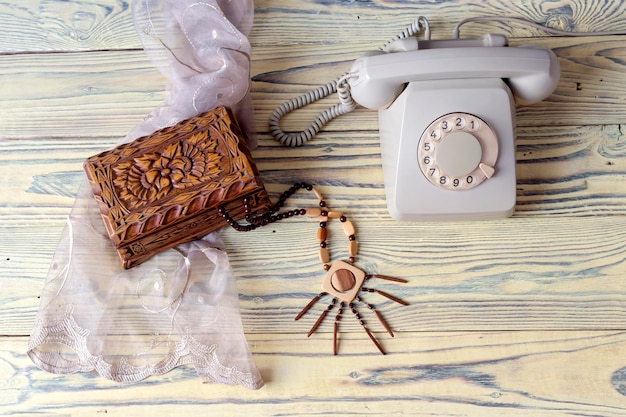 An old telephone on a wooden table