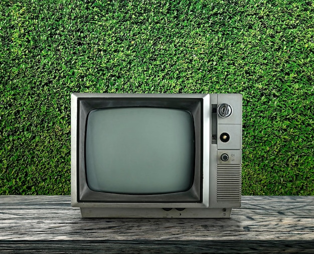 Old television vintage on wooden with black background Retro vintage TV style