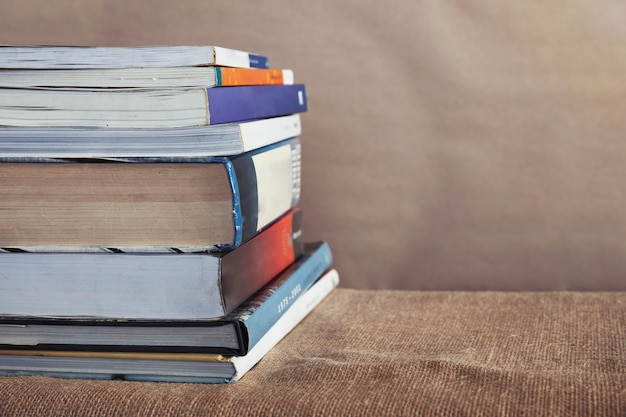 Old textbook different size stack on the table with copy space