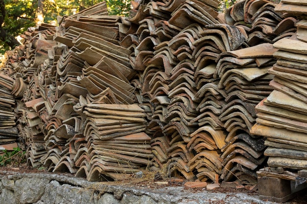 Old tiled roof stacked for restoration Background Selective focus