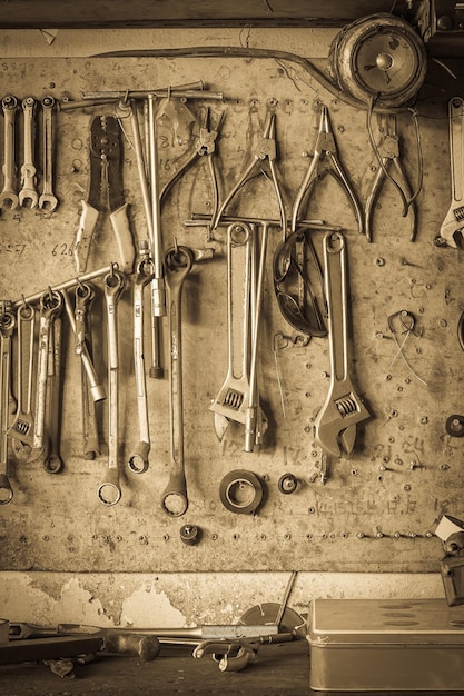 Photo old tool shelf against a wall vintage style