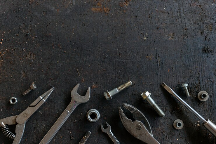 Photo old tools on black wooden floor background
