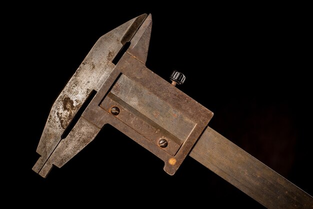 Old tools in front of a black