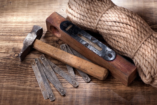 Old tools hammer ruler and level vintage background with a tools