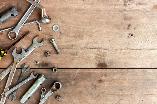 Old tools on wooden floor background