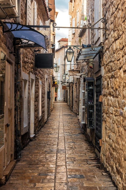 Old Town Budva Montenegro The first mention of this city more than 26 centuries ago We see ancient houses a very narrow street cafes shops