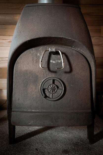 Photo old traditional cast iron wood stove closeup view