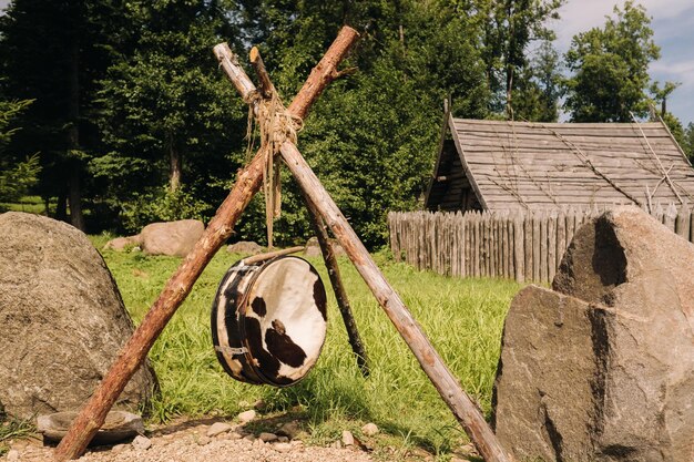 An old traditional drum with fur hanging in a medieval village