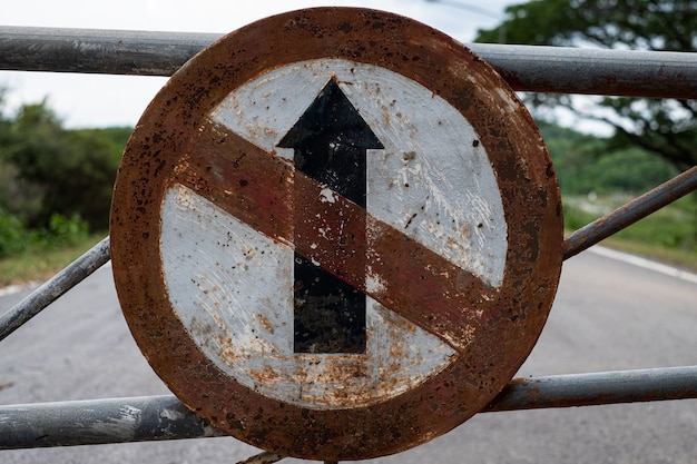 Old traffic sign does not go straight direction sign on the\
road