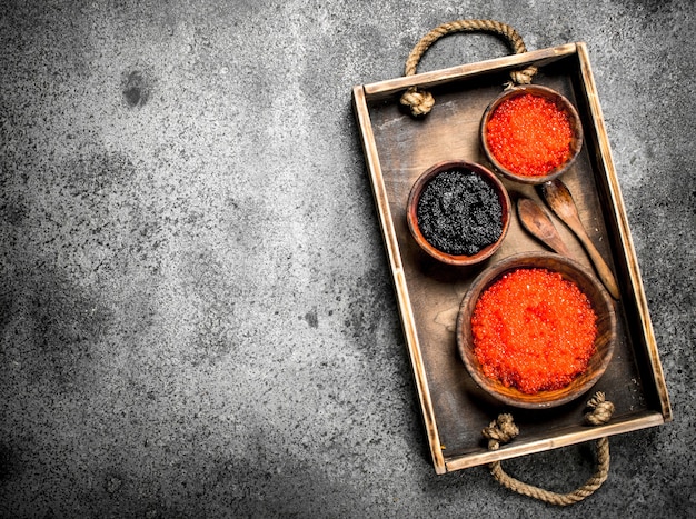 Old tray with black and red caviar