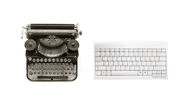 Old typewriter and modern keyboard