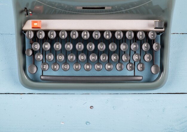 Old typewriter on wooden table