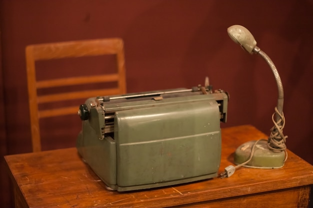 Photo old typewriters and old lantern.