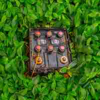 Photo old used car batteries in green grass improper disposal of batteries