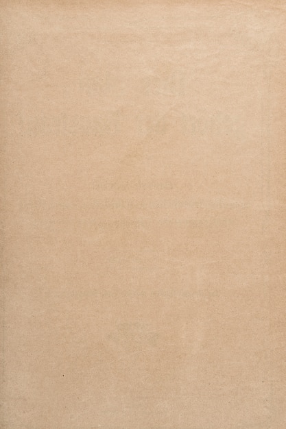 Old used paper sheet texture. Empty brown kraft background