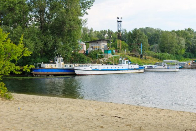 Old vessels moored in harbor