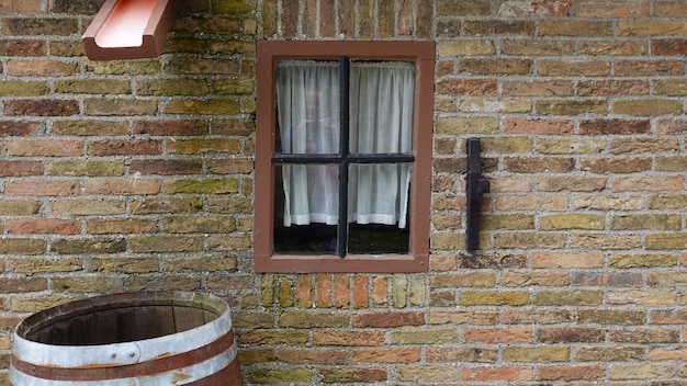 Old village in North Holland Windows and bright flowers textural walls of houses