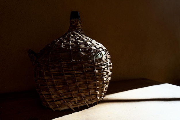 Old vintag carafe in the shadow background