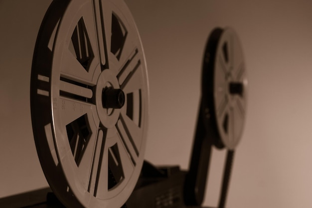 Photo old vintage 8mm projector with film reels and film frames copy space selective focus