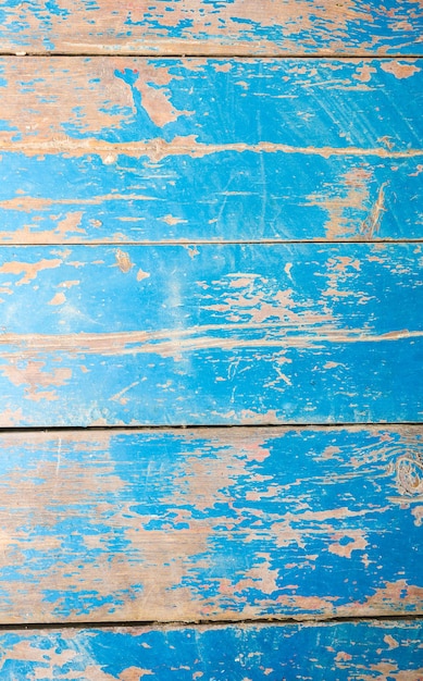 Old vintage blue and beige painted wooden planks. Rustic background texture.