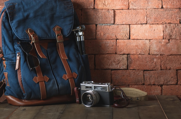 Old vintage canvas bag with vintage camera 