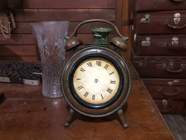 An old vintage clock on the table