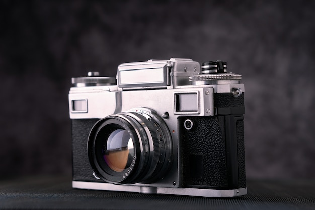 Old vintage film 36mm photo camera, lifestyle memory. take\
pictures with a manual lens history.