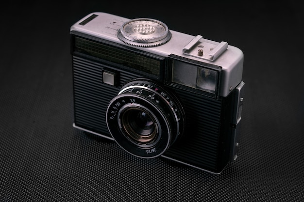 Old vintage film 36mm photo camera, lifestyle memory. Take pictures with a manual lens history.