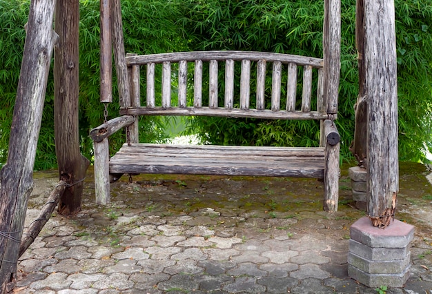 Old vintage wooden chair in the park