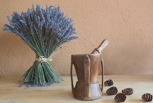 Old vintage wooden mortar and dried lavender and dried pineapple 