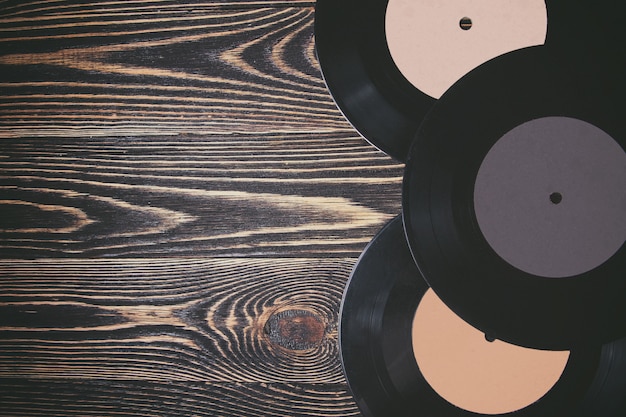 Old vinyl record on the wooden table