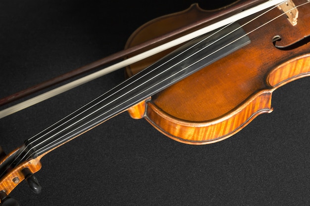 Old violin on a black background