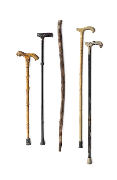 Photo old walking crutches on white background