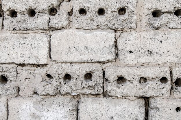 Old wall of cinder blocks as an abstract background