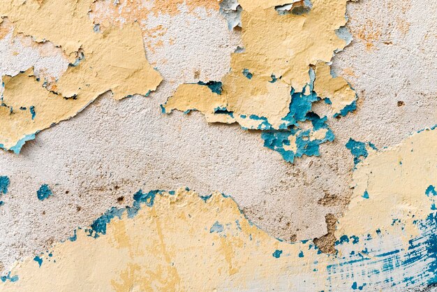 Old wall with peeling blue paint