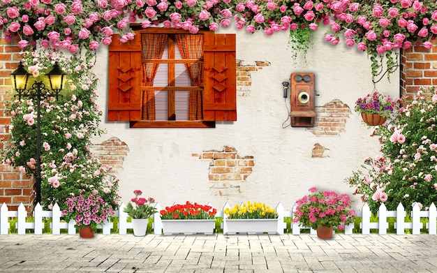 Старая стена с окном и цветами. напольный старый телефон и ваза в экстерьере дома