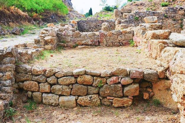 Old walls of houses in Morgantina old town archaeological site, Sicily, Italy