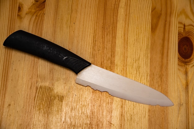 Old white ceramic knife with a broken blade broken substandard knife